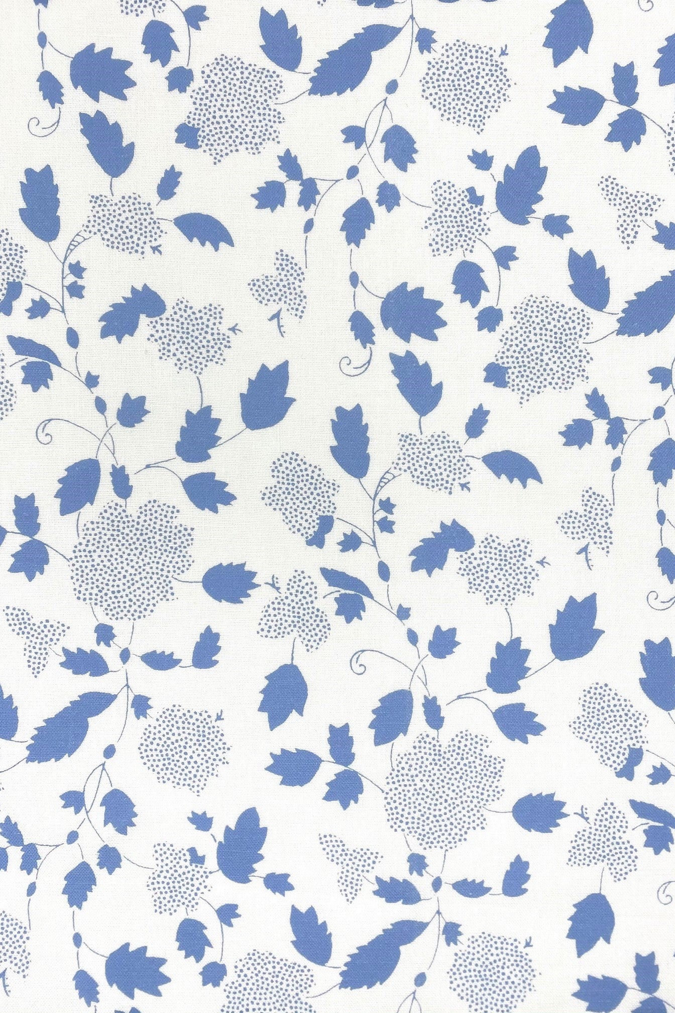 Floral fabric printed on sustainable linen for interiors in blue color.