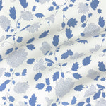 Floral fabric printed on sustainable linen for interiors in blue color.