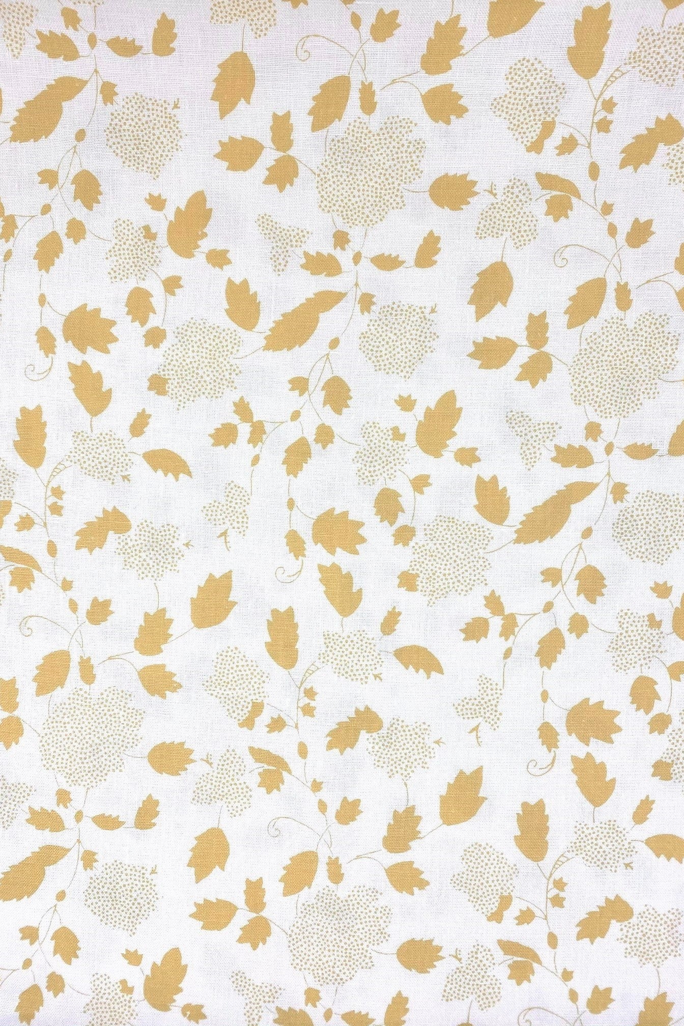 Floral fabric printed on sustainable linen for interiors in yellow color.