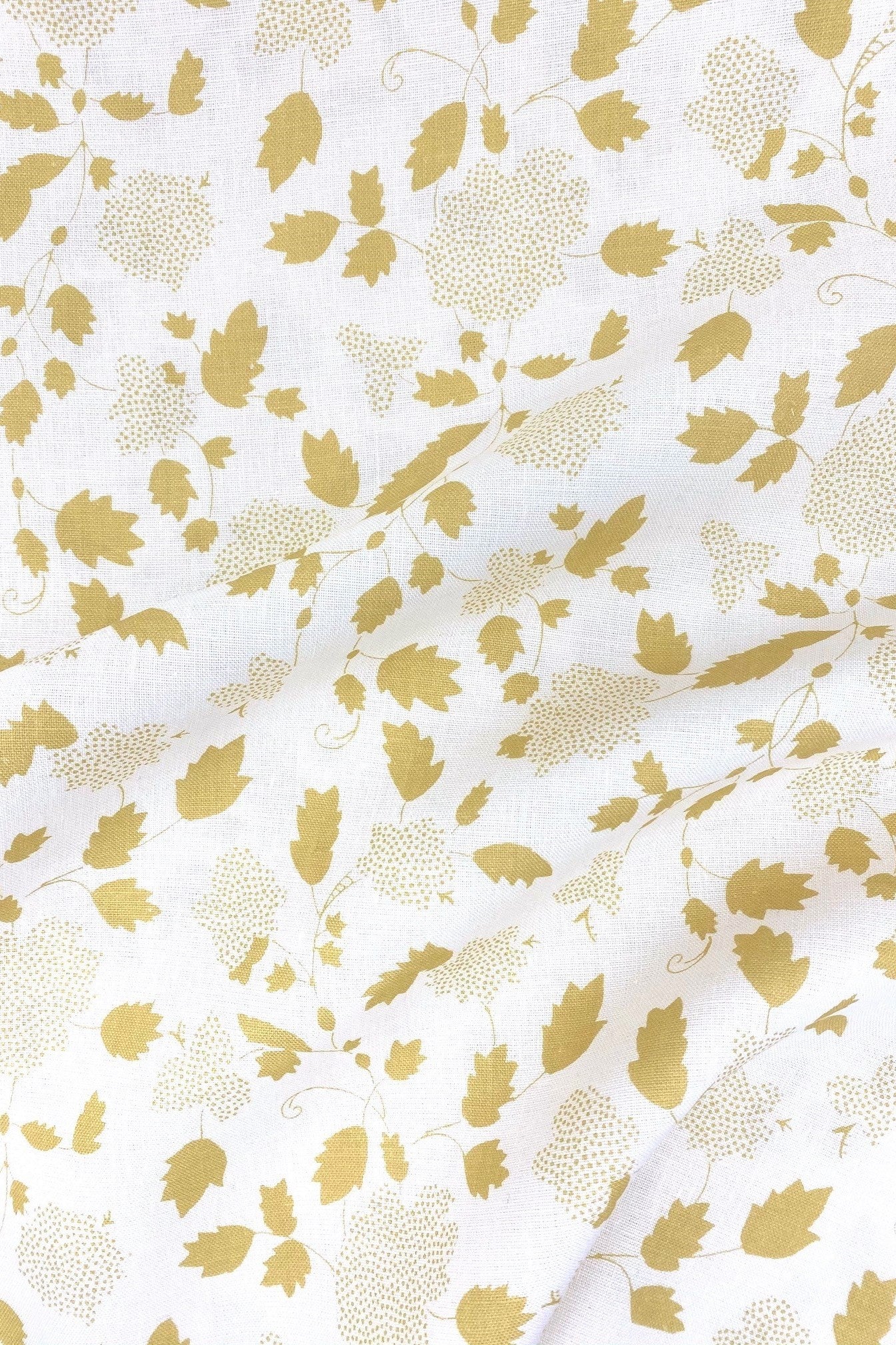 Floral fabric printed on sustainable linen for interiors in yellow color.