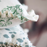 Floral linen pillows with ruffles in soft colors