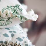 Floral linen pillows with ruffles in soft colors