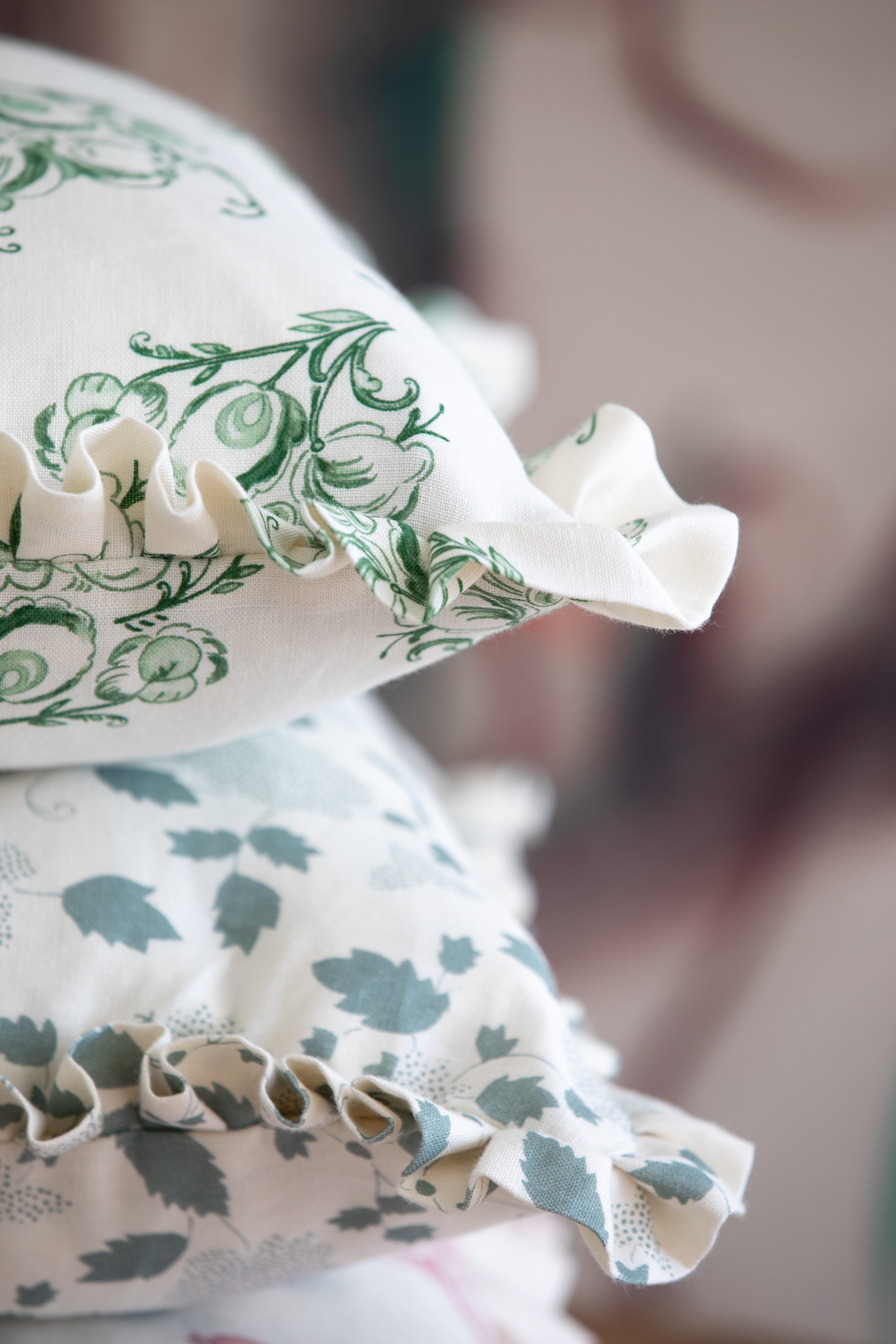 Floral linen pillows with ruffles in soft colors