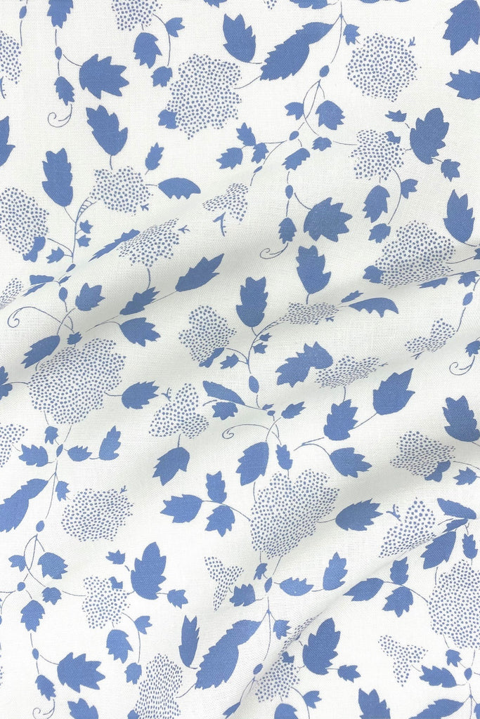 Floral fabric printed on sustainable linen for interiors in blue color.